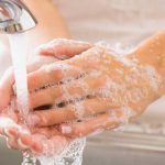 Photo: washing hands under running water