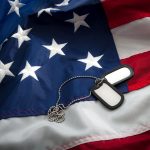 Dog tags on top of the American flag