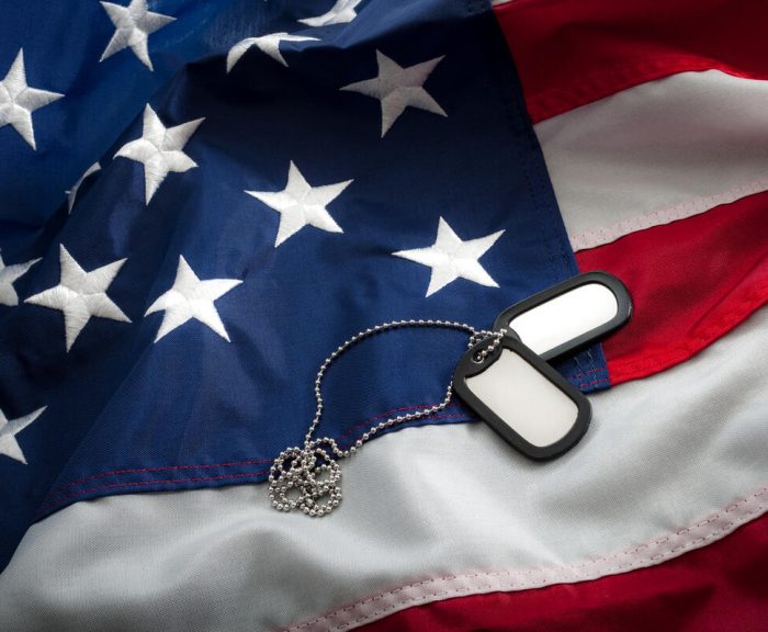 Dog tags on top of the American flag